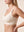 Cream su modella, di profilo: sostegno visibile senza ferretto